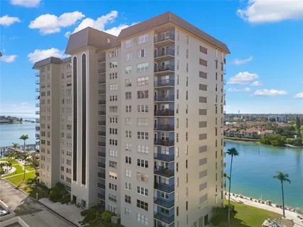 a view of a swimming pool and trees
