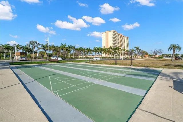 a swimming pool with outdoor seating yard and plants