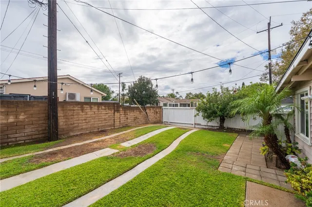 a view of a backyard with sitting area