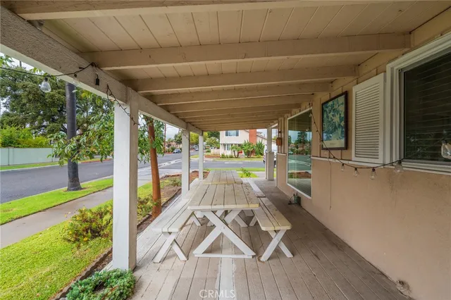 a view of a porch with wooden floor