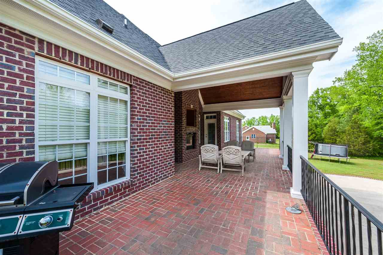 3132 McDade Farm Road Raleigh, NC 27616 - Photo 8 of 24 Museum Quality Construction With Grand Entertaining Areas. Grilling and Lounging Will Accommodate Your Guests For Entertainment. Exterior Back Deck