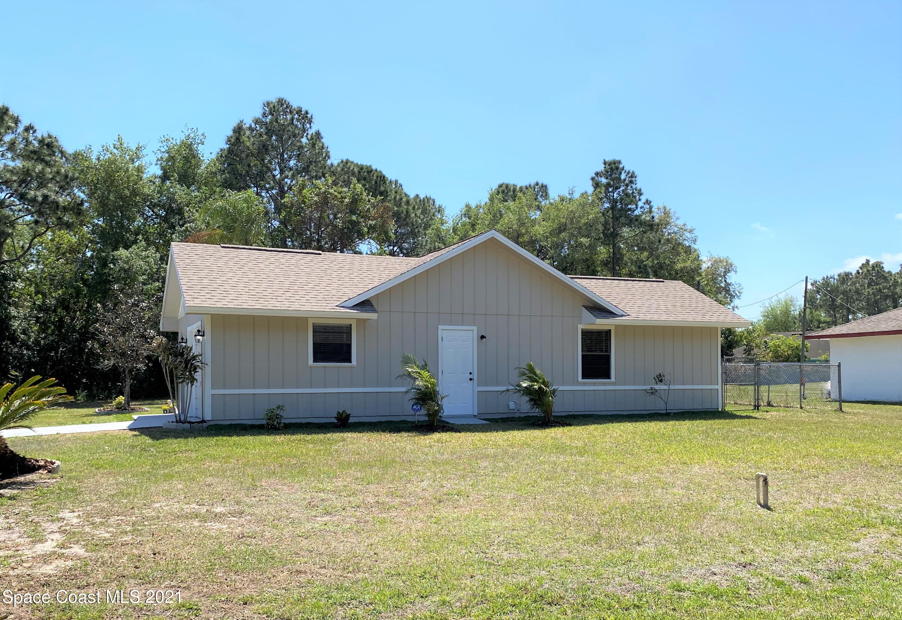 791 Atlantis Road Southeast Palm Bay, FL 32909 - Photo 22 of 23 22 Side