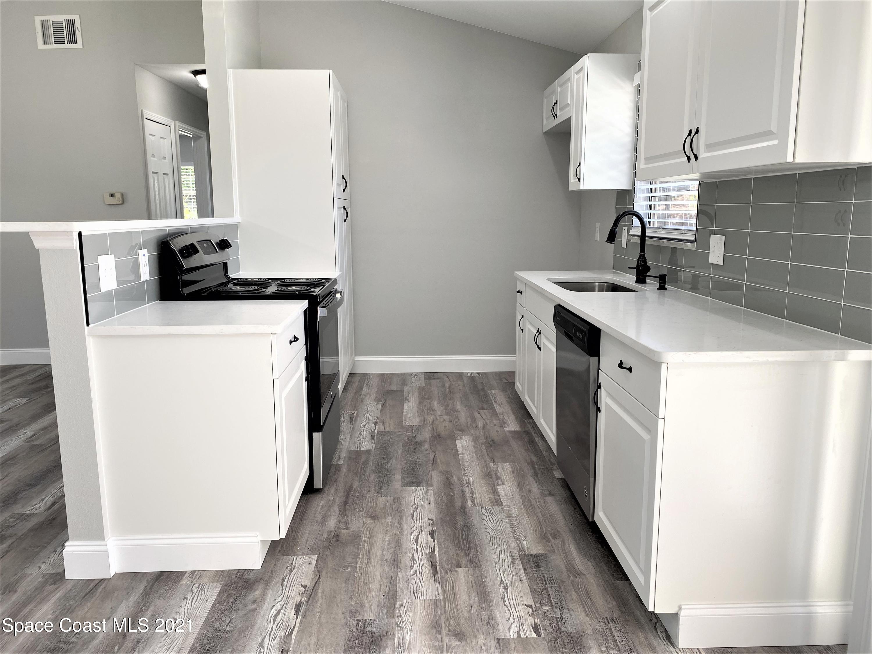791 Atlantis Road Southeast Palm Bay, FL 32909 - Photo 7 of 23 7 Kitchen 2