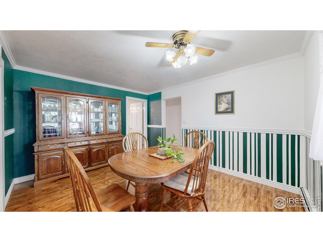12775 East County Line Road Longmont, CO 80504 - Photo 12 of 40 a living room with furniture a chandelier and a dining table