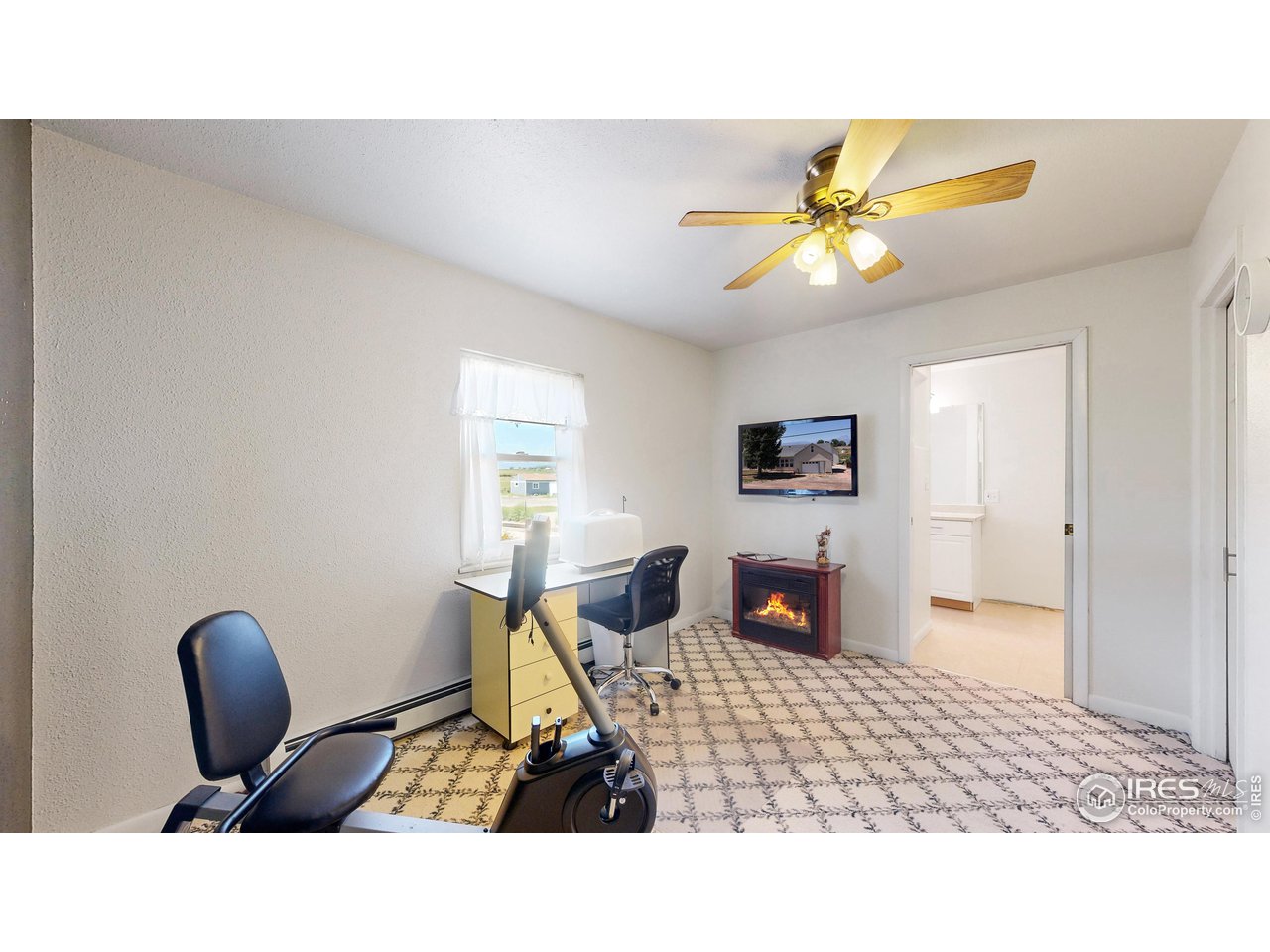 12775 East County Line Road Longmont, CO 80504 - Photo 16 of 40 a living room with furniture and a flat screen tv