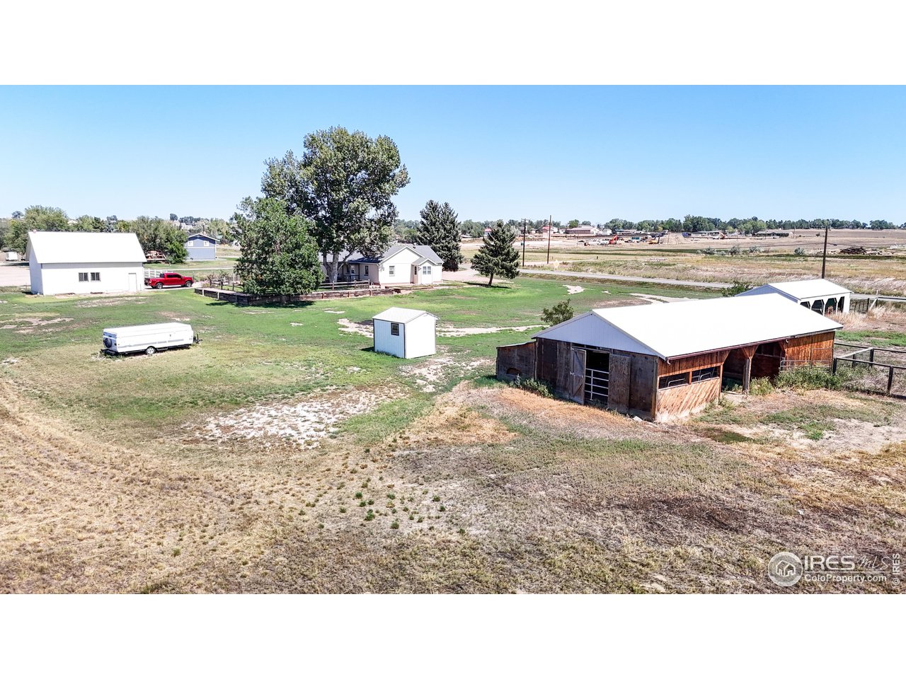 12775 East County Line Road Longmont, CO 80504 - Photo 32 of 40 a view of a swimming pool and a yard