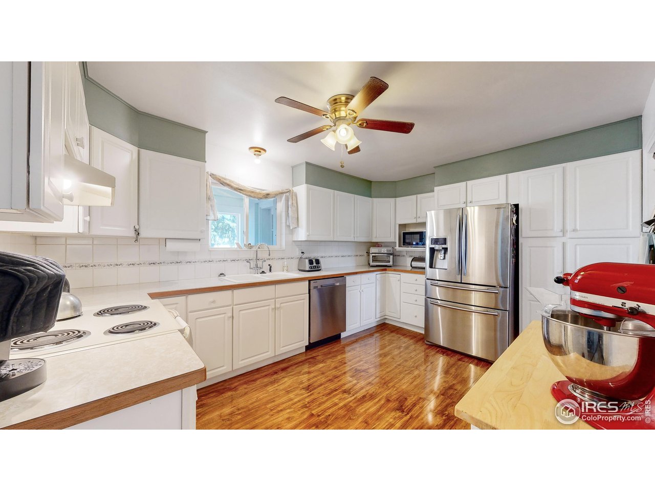 12775 East County Line Road Longmont, CO 80504 - Photo 8 of 40 a kitchen with a sink stainless steel appliances and cabinets