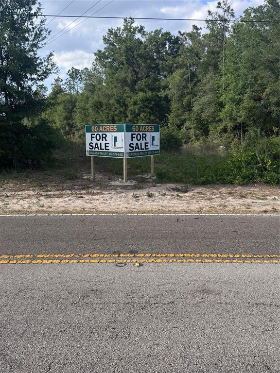 4625 West Kelly Park Road Apopka, FL 32712 - Photo 1 of 13 a sign that is sitting on the side of a road