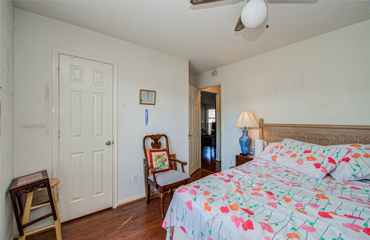 1634 Ridgebriar Drive Houston, TX 77014 - Photo 17 of 31 a bedroom with bed and wooden floor