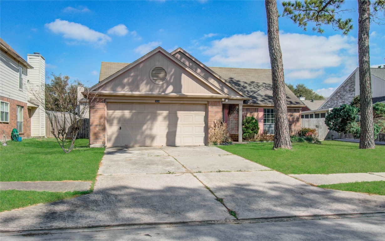 1634 Ridgebriar Drive Houston, TX 77014 - Photo 3 of 31 a front view of a house with a yard