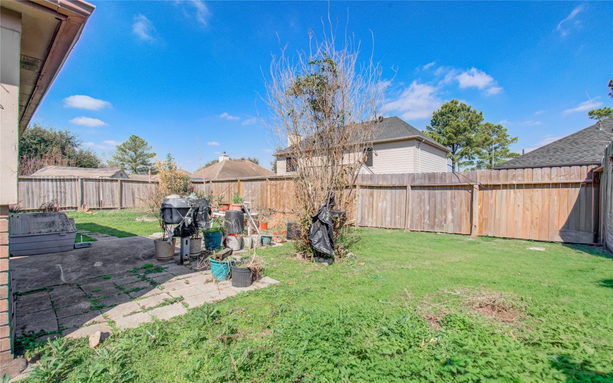 1634 Ridgebriar Drive Houston, TX 77014 - Photo 31 of 31 a view of a backyard with a garden