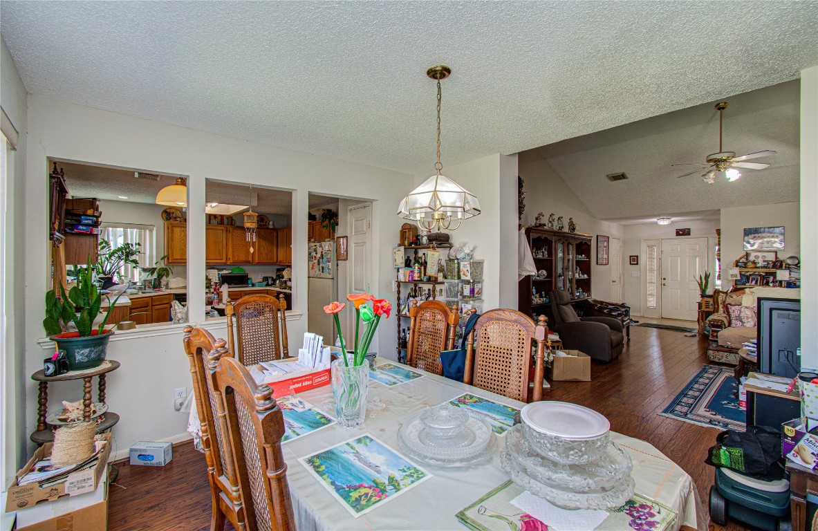 1634 Ridgebriar Drive Houston, TX 77014 - Photo 10 of 31 a outdoor dining room with furniture a chandelier and wooden floor