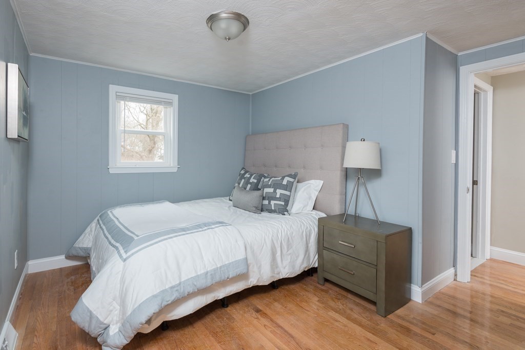 299 Center Street Randolph, MA 02368 - Photo 15 of 32 a bedroom with a bed and a window