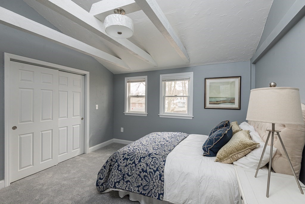 299 Center Street Randolph, MA 02368 - Photo 19 of 32 a bedroom with a bed and a window