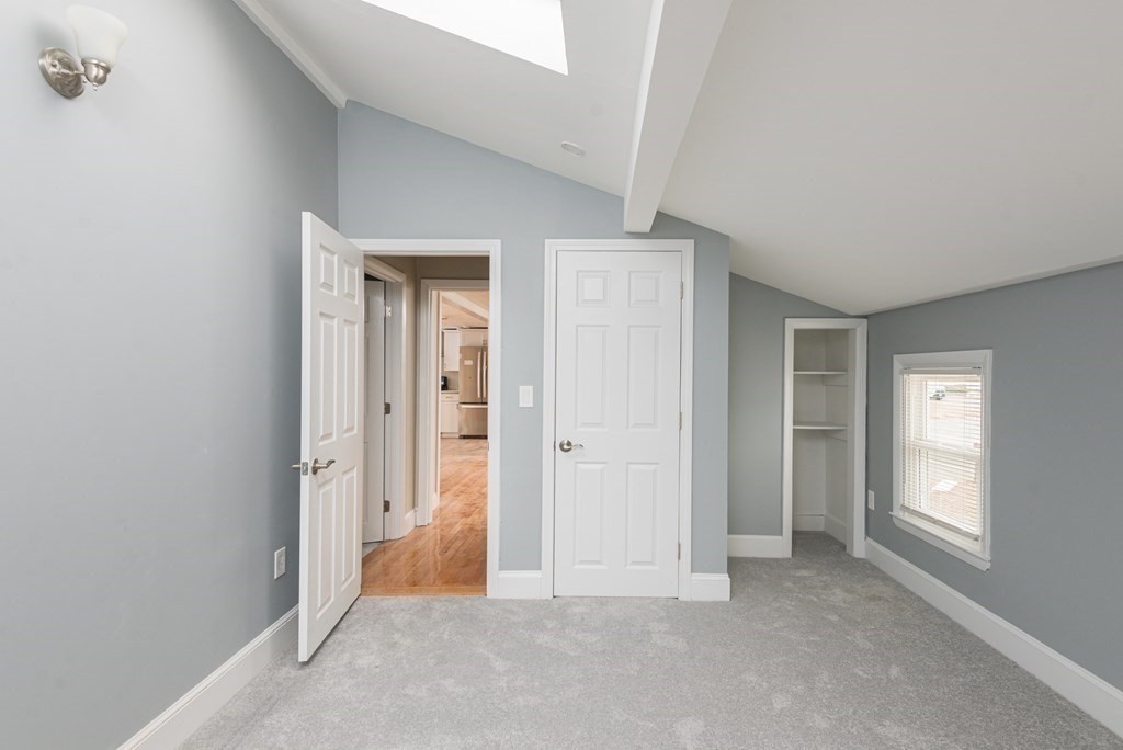 299 Center Street Randolph, MA 02368 - Photo 21 of 32 an empty room with windows and closet