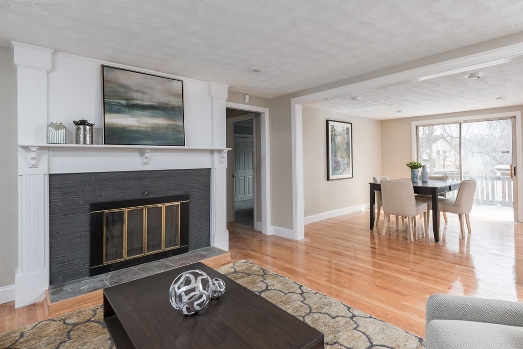299 Center Street Randolph, MA 02368 - Photo 3 of 32 a living room with furniture and a fireplace
