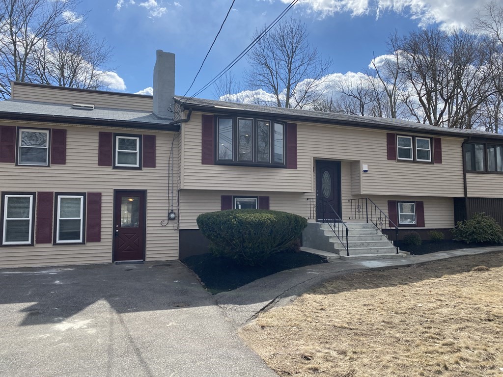 299 Center Street Randolph, MA 02368 - Photo 32 of 32 a front view of a house with a yard