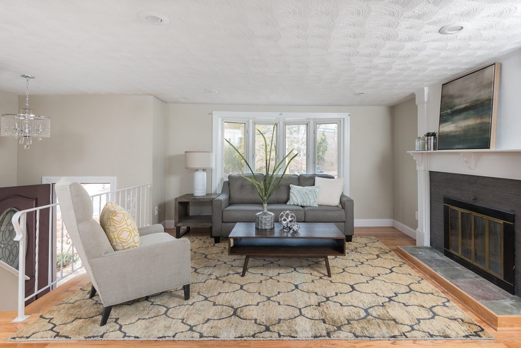 299 Center Street Randolph, MA 02368 - Photo 4 of 32 a living room with furniture and a fireplace