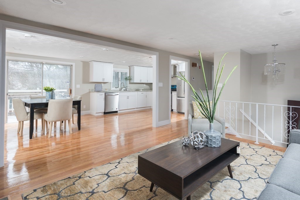 299 Center Street Randolph, MA 02368 - Photo 7 of 32 a living room with furniture and a table