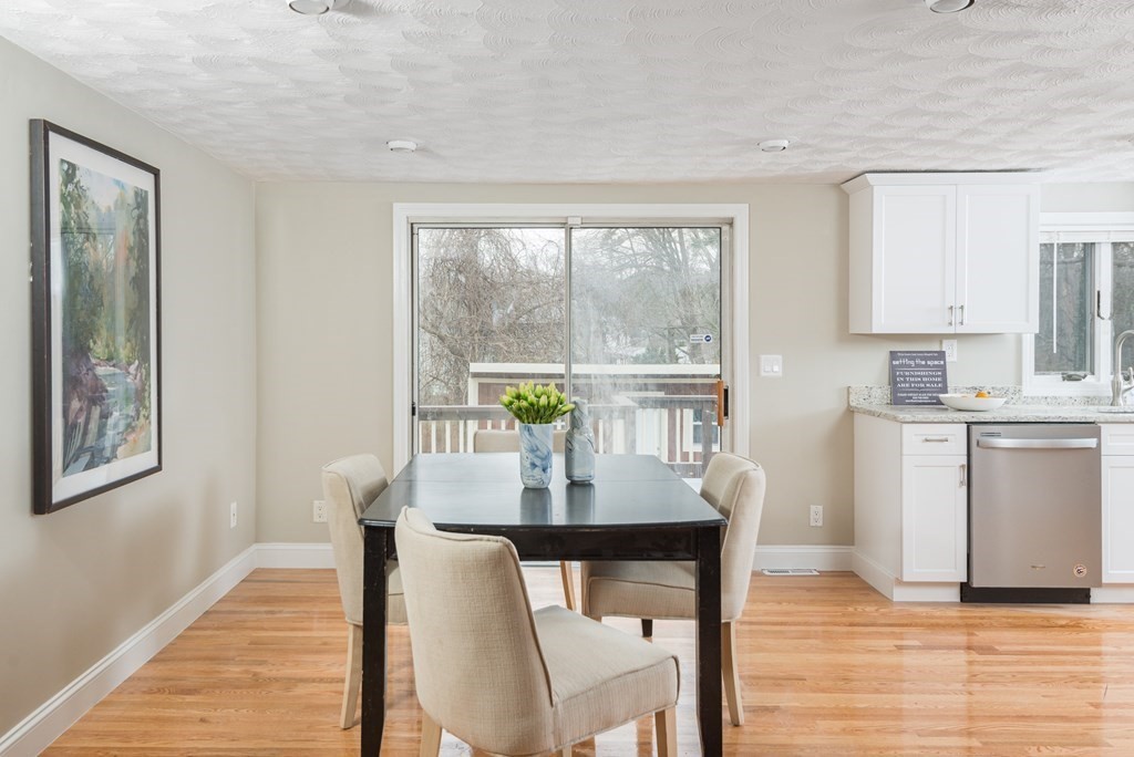 299 Center Street Randolph, MA 02368 - Photo 9 of 32 a dining room with furniture and wooden floor