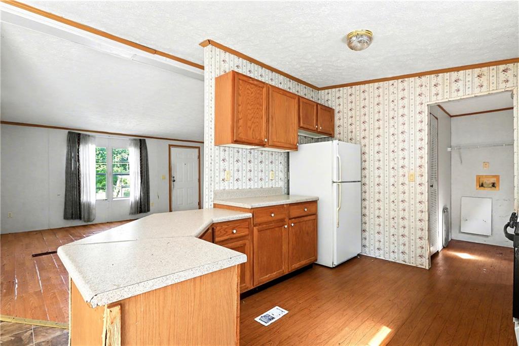 249 John Golden Road Temple, GA 30179 - Photo 21 of 45 a view of a kitchen cabinets and wooden floor