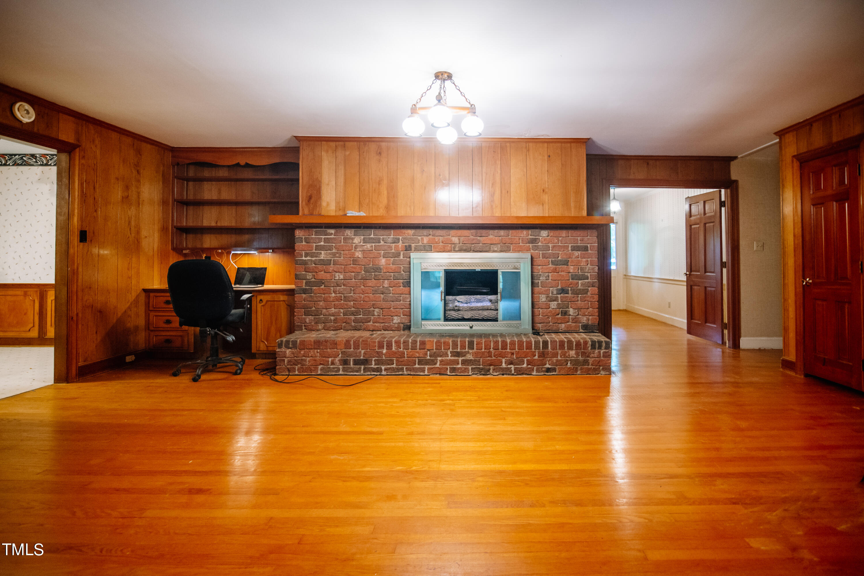 6700 Valley Lake Drive Raleigh, NC 27612 - Photo 12 of 23 a living room with fireplace furniture and a fireplace