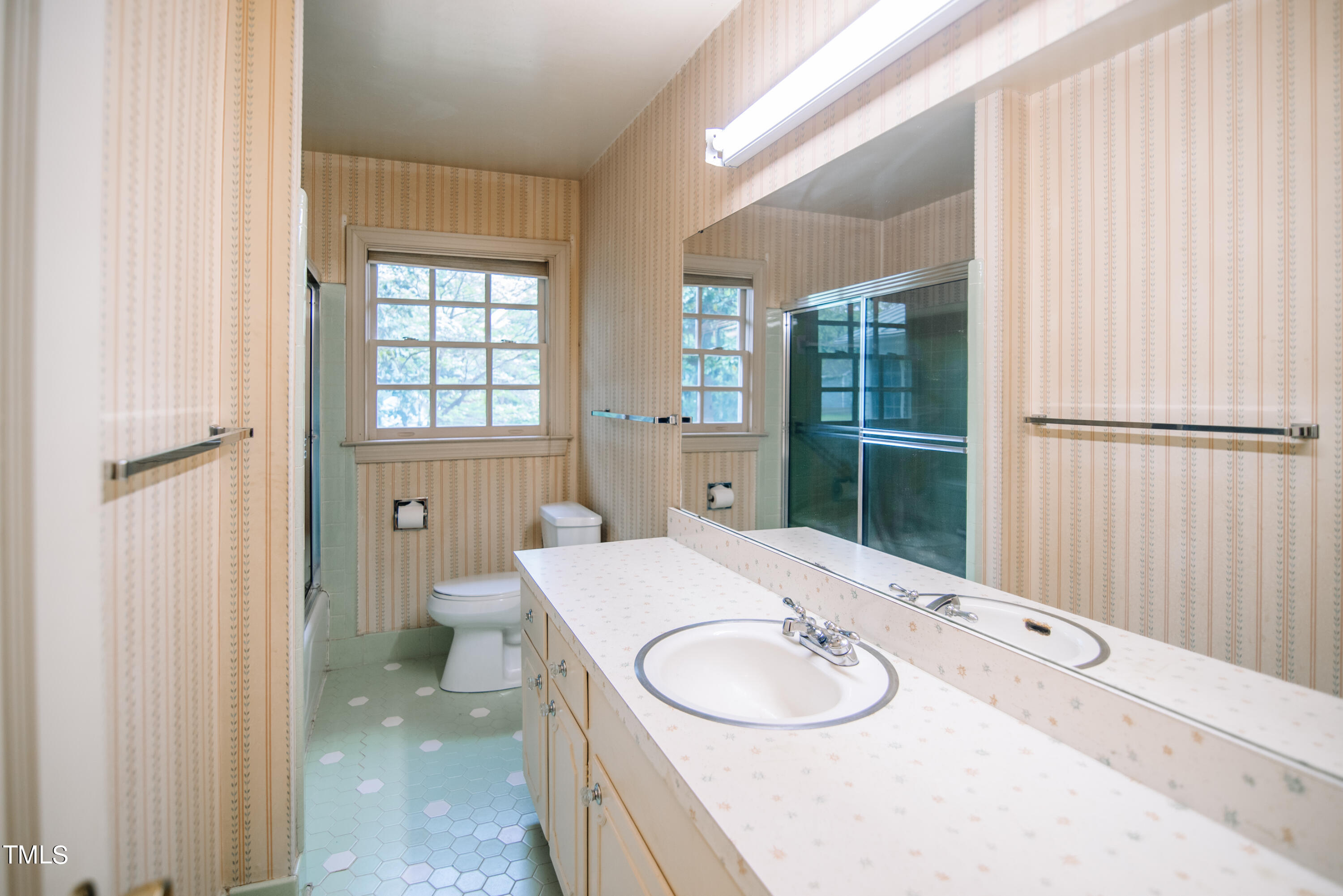 6700 Valley Lake Drive Raleigh, NC 27612 - Photo 18 of 23 a bathroom with a sink and a mirror