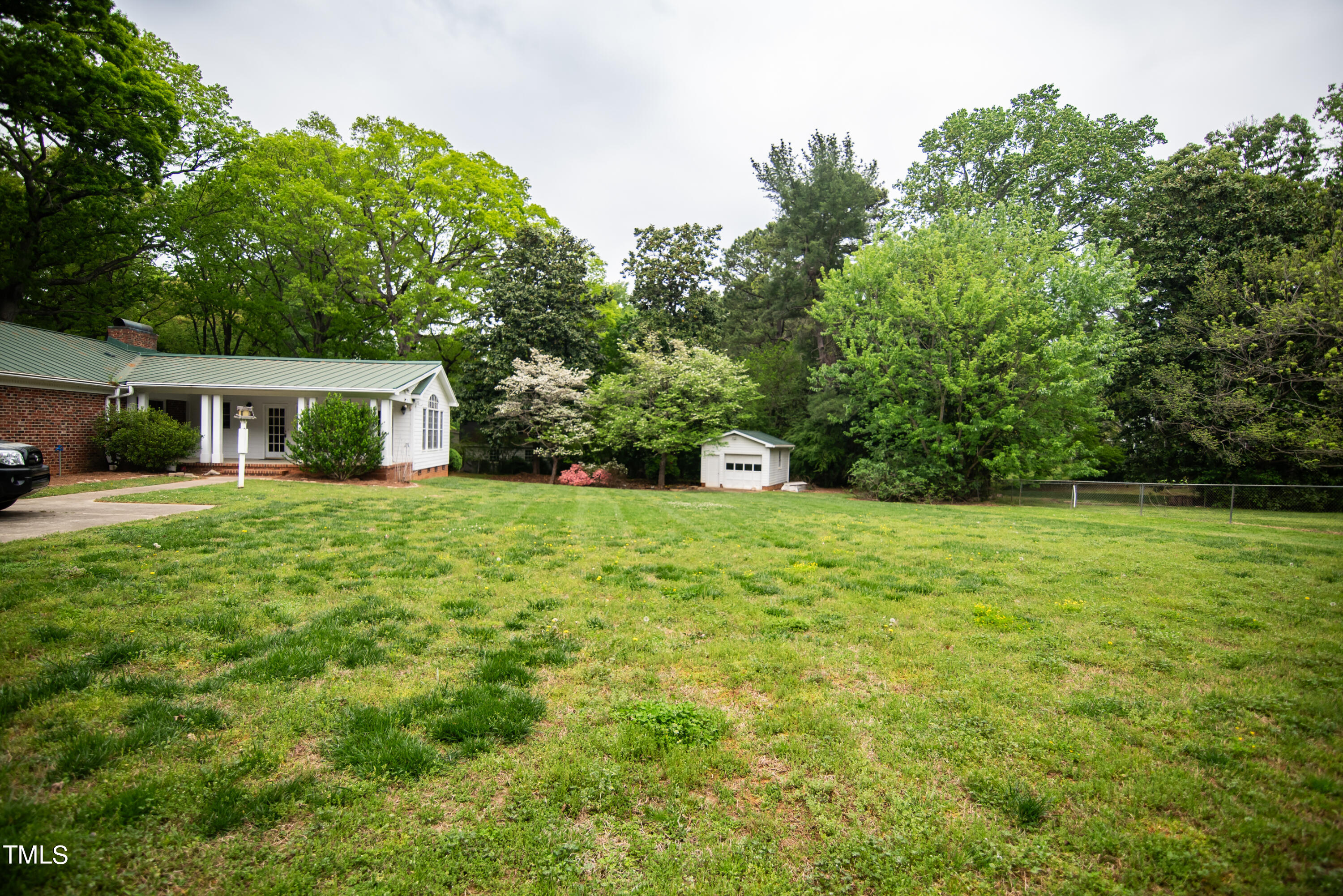 6700 Valley Lake Drive Raleigh, NC 27612 - Photo 23 of 23 a view of house that has garden