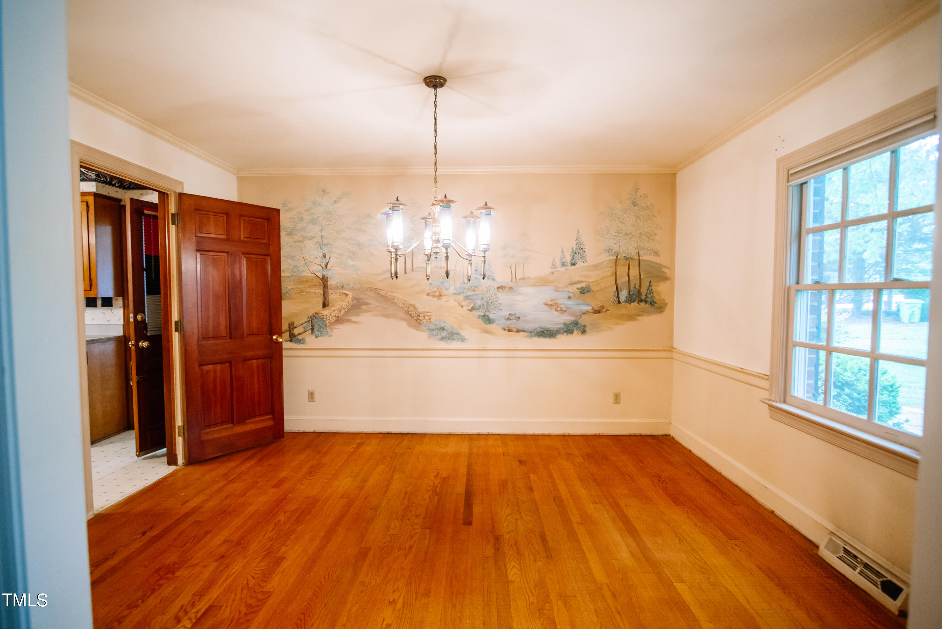 6700 Valley Lake Drive Raleigh, NC 27612 - Photo 8 of 23 a view of a refrigerator in kitchen and wooden floor