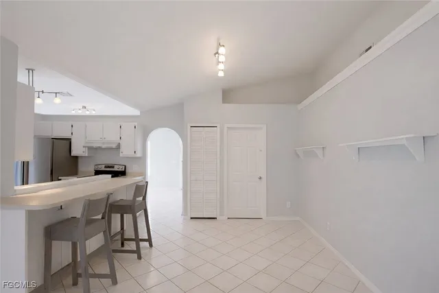 a bathroom with a sink a mirror and a vanity