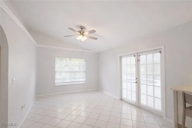a white toilet sitting next to a window