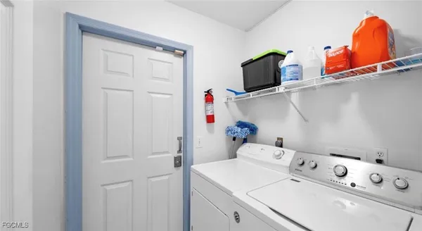 a view of a room with shelf and racks on the wall