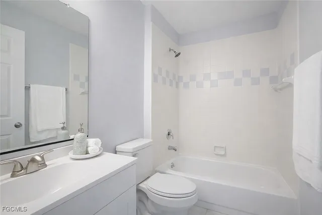 a view of a swimming pool with a patio and yard