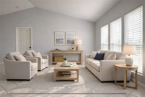 a living room with furniture and a large window