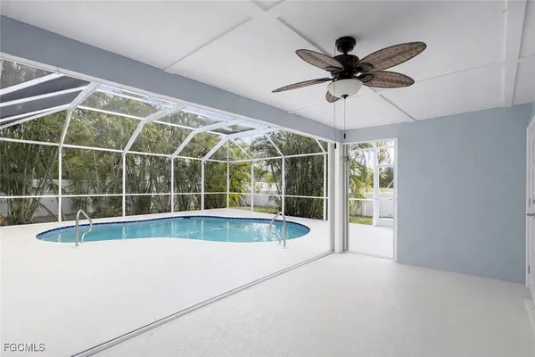 a view of a backyard with a swimming pool