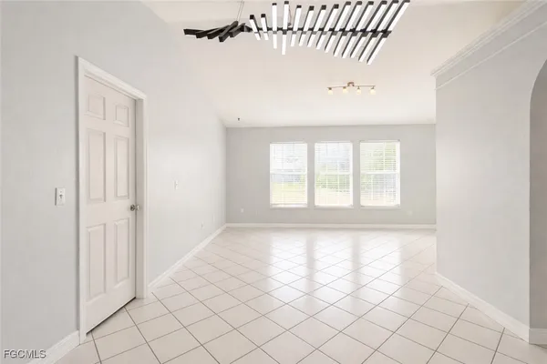 a view of an empty room and window