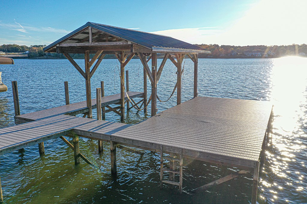 986 Ridgewood Harbor Road Waterloo, SC 29384 - Photo 4 of 43 a view of a roof deck with table and chairs with wooden floor