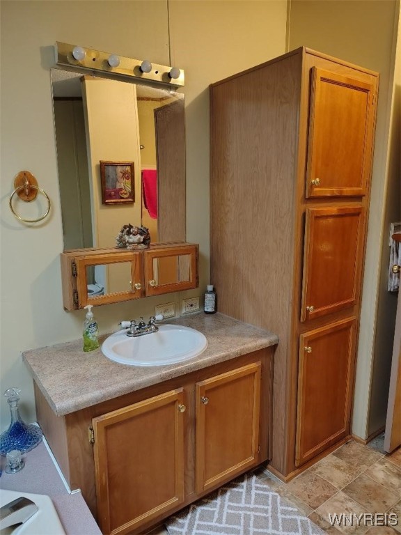 1186 Vinewood Drive Lockport Town, NY 14094 - Photo 16 of 23 Another view of vanity and storage in ensuite bath