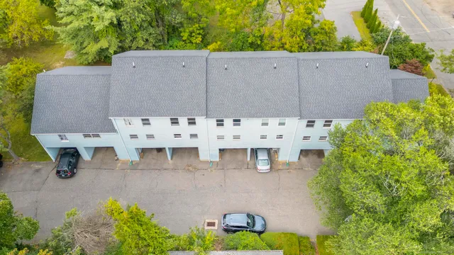 an aerial view of a house with outdoor space and garden view