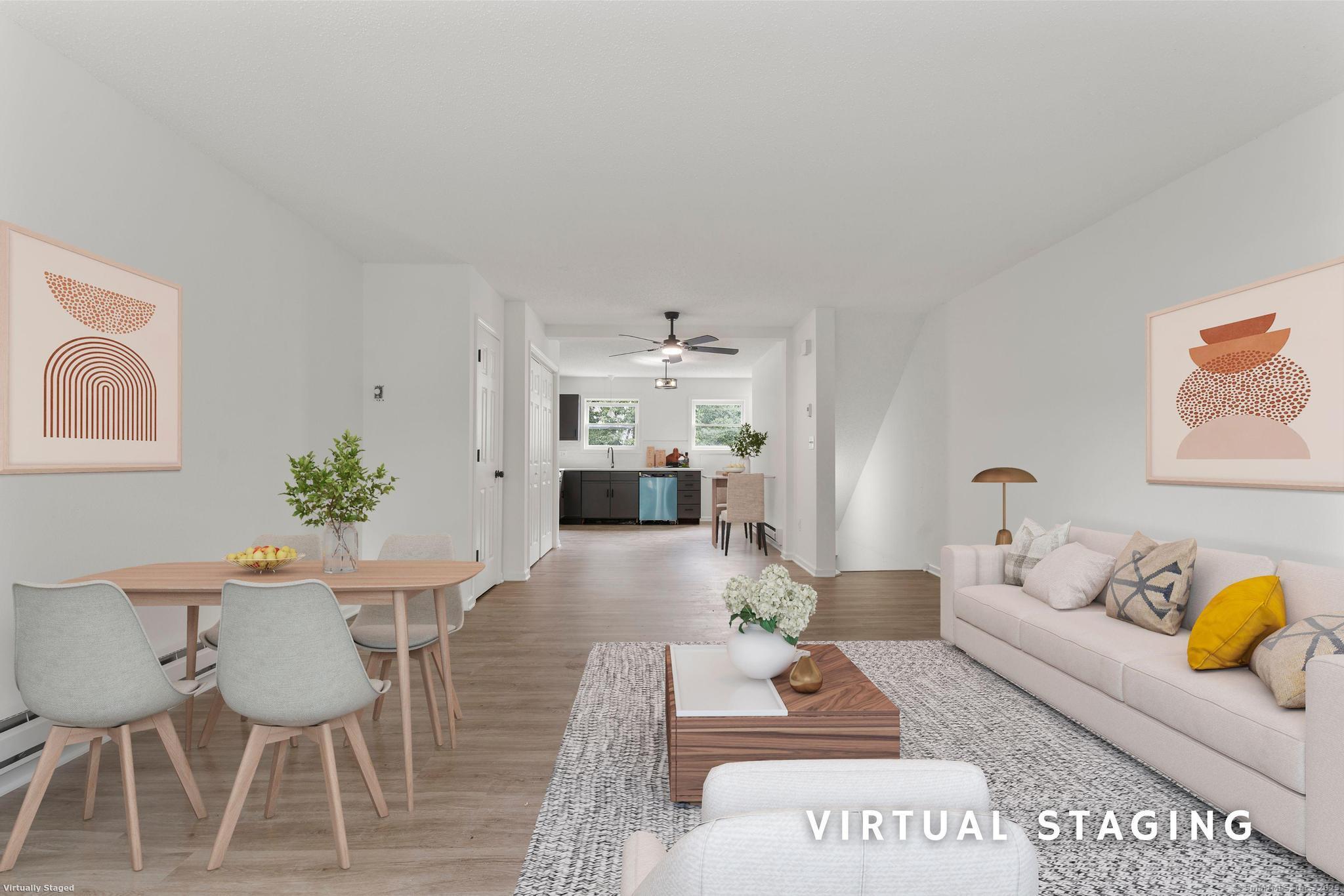 333 Hillside Avenue, Unit 10 Torrington, CT 06790 - Photo 5 of 33 a living room with furniture and wooden floor