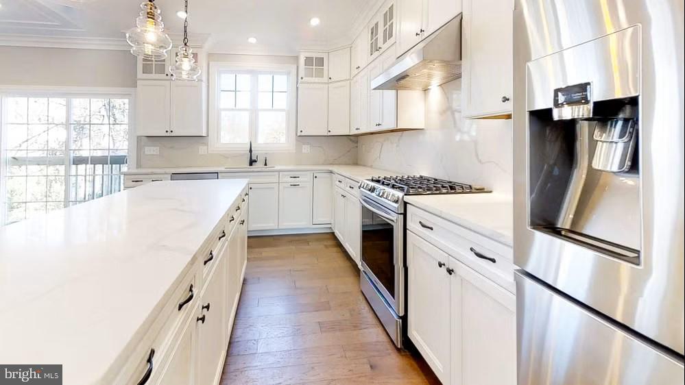 396 A Tavistock Boulevard Haddonfield, NJ 08033 - Photo 16 of 29 a kitchen with stainless steel appliances granite countertop a sink a stove and a refrigerator