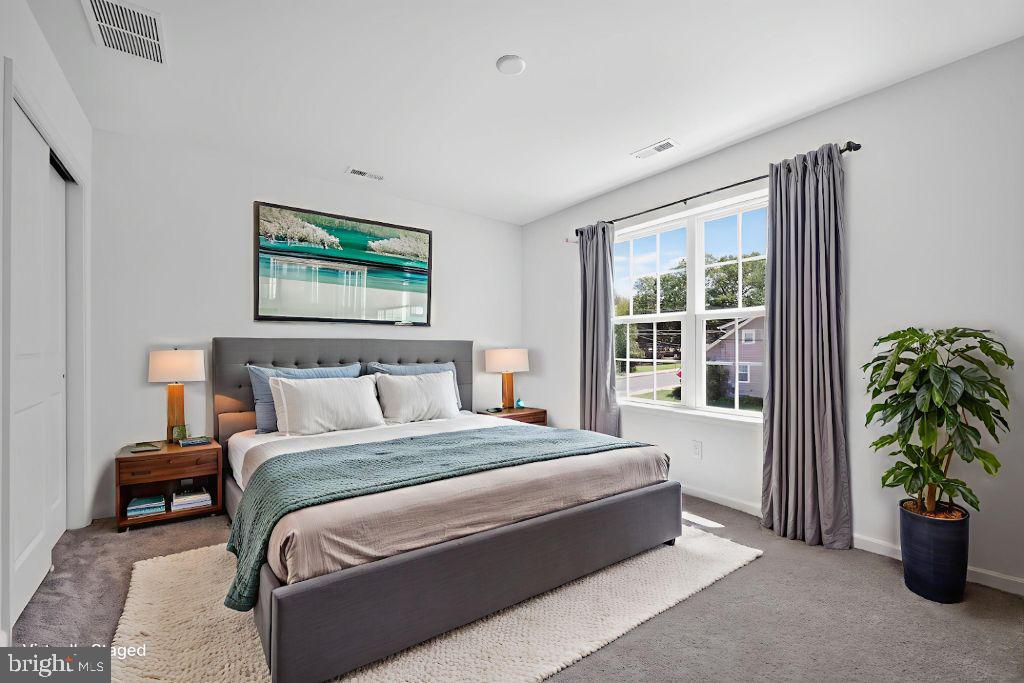 396 A Tavistock Boulevard Haddonfield, NJ 08033 - Photo 21 of 29 a spacious bedroom with a bed and a window