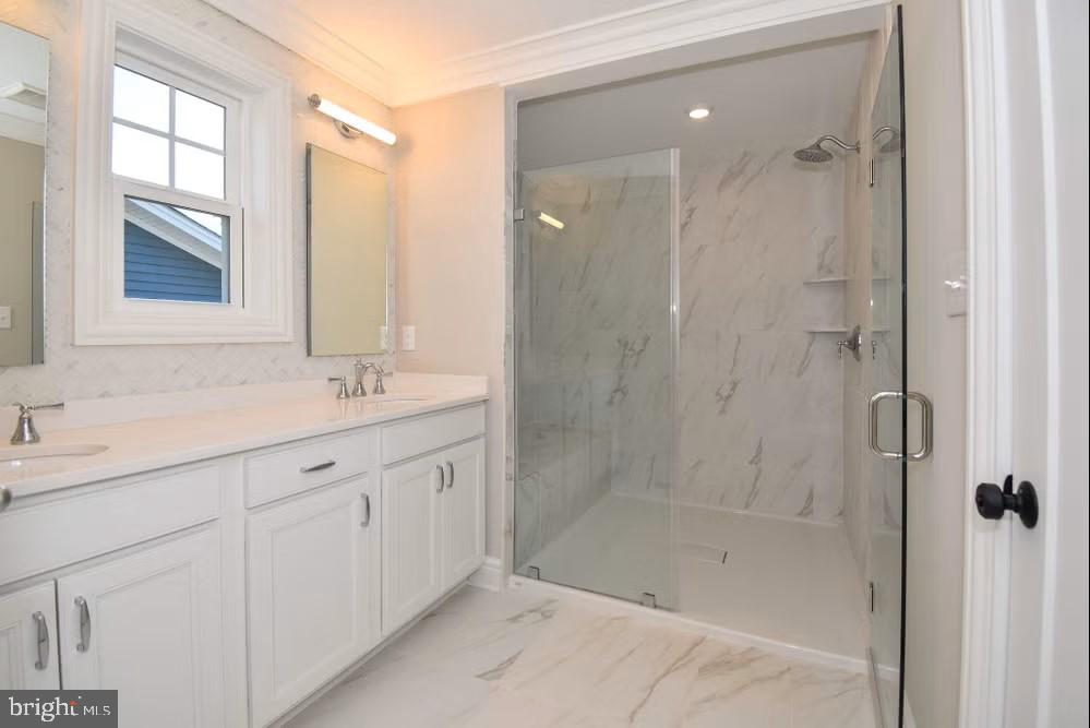 396 A Tavistock Boulevard Haddonfield, NJ 08033 - Photo 22 of 29 a bathroom with a shower sink and mirror