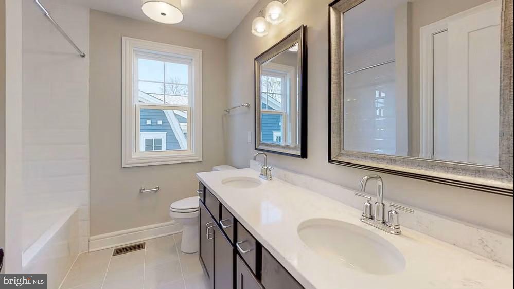 396 A Tavistock Boulevard Haddonfield, NJ 08033 - Photo 24 of 29 a bathroom with a sink and a mirror