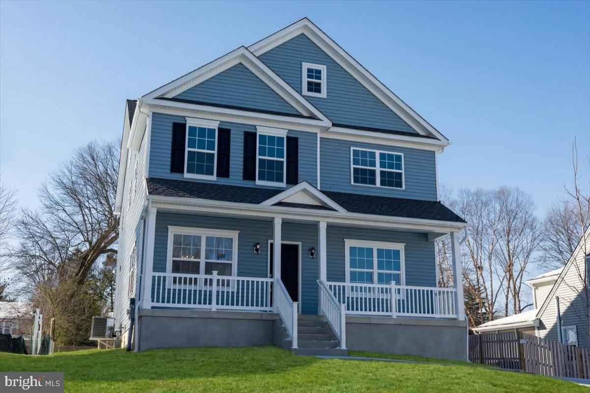 396 A Tavistock Boulevard Haddonfield, NJ 08033 - Photo 3 of 29 a front view of a house with a yard