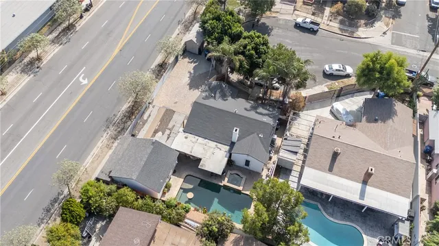 an aerial view of a house with a yard