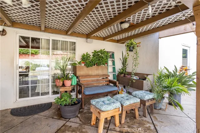 a swimming pool view with a outdoor seating