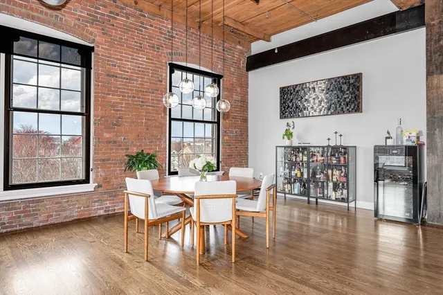 a bedroom with a bed and a flat tv screen on the dresser
