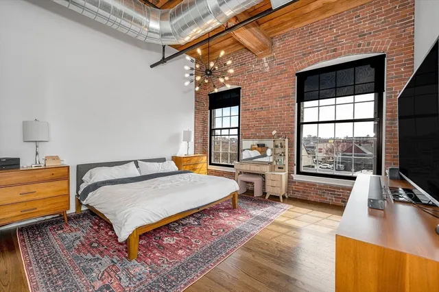 a spacious bathroom with a tub sink and mirror