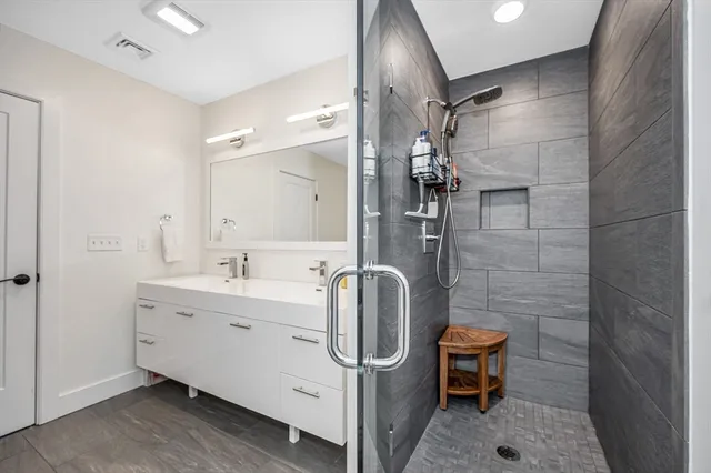 a view of a livingroom with workspace and a window